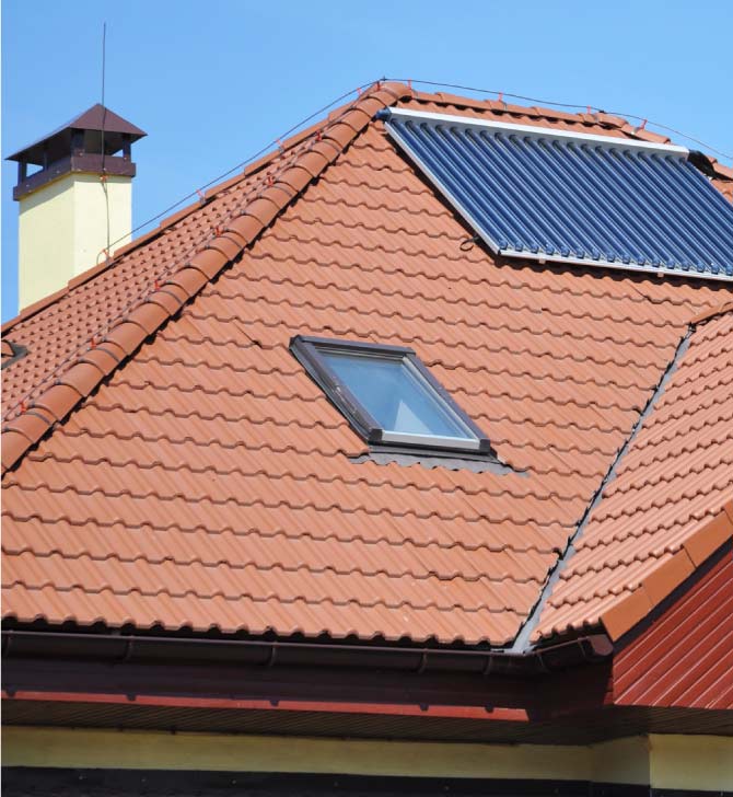 Energy-efficient skylight installed on a durable dark tile roof in Vacaville, improving home ventilation and natural light as part of a complete roof system remodel by Capital Roofcare.