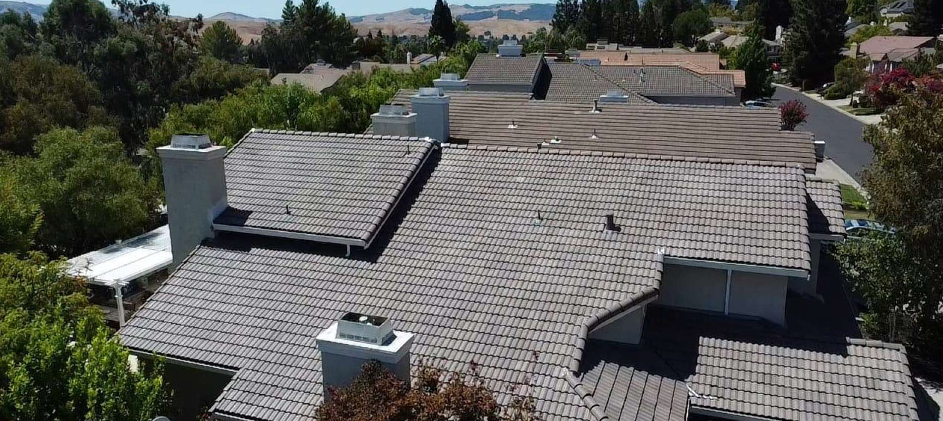 professional roofer performing torch down modified bitumen installation
