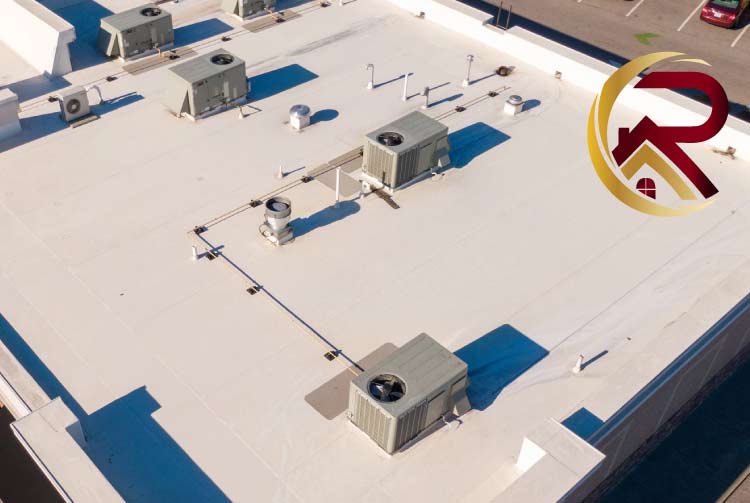 Aerial view of a large white commercial TPO flat roof featuring multiple commercial HVAC units, gas lines, and plumbing vents, with a red and gold company logo on the right side.
